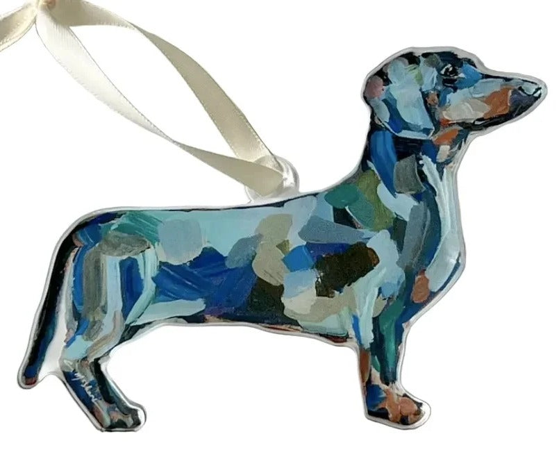 Decorative ornament shaped like a dachshund with a colorful abstract pattern on a white background.