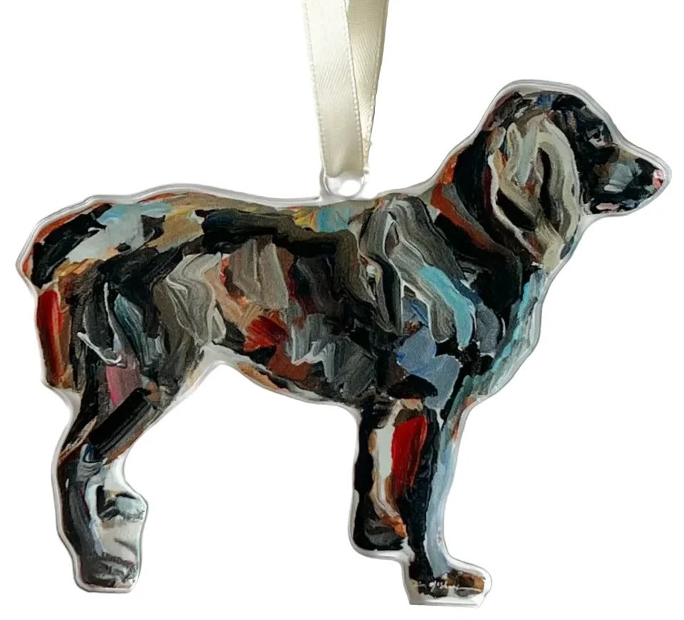 Acrylic ornament depicting a blurred image of a dog, with a ribbon at the top.