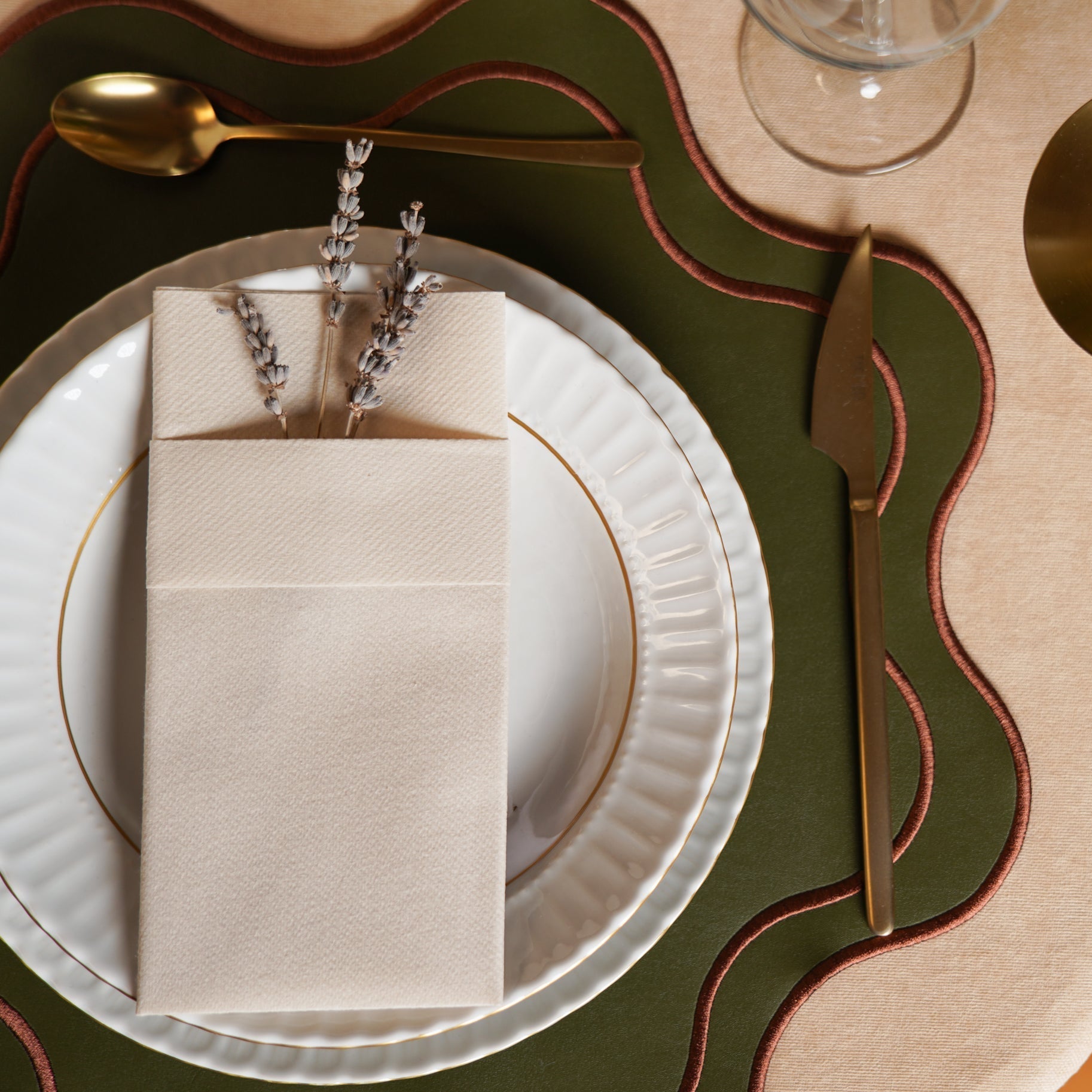 Haven Dark Green with Brown Trim Wavy Edge Faux Leather Placemat
