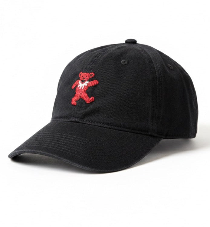 Black cap with a red bear logo on a white background