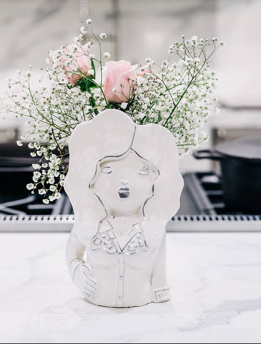 Decorative vase with floral arrangement on a kitchen counter