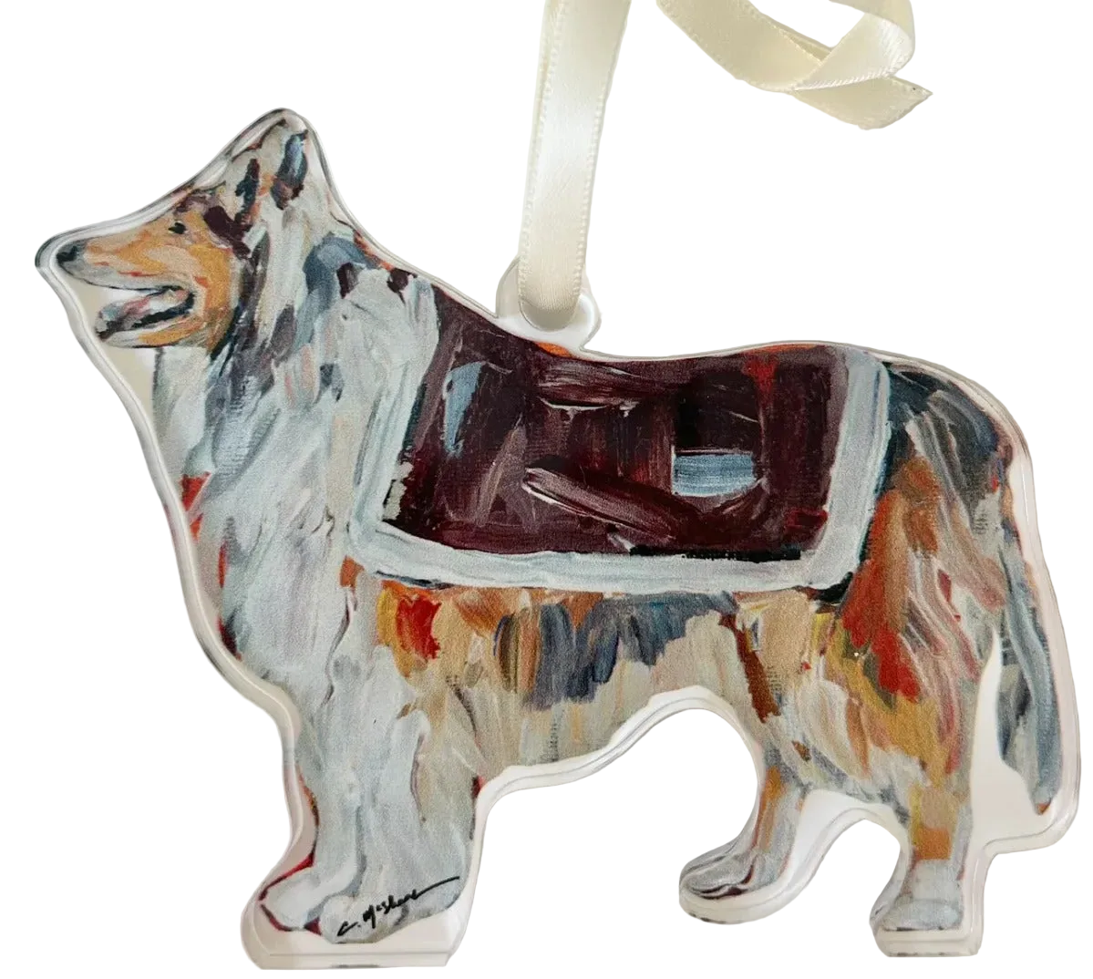 A hand-painted acrylic ornament in the shape of a Corgi dog with a colorful Christmas tree ornament.