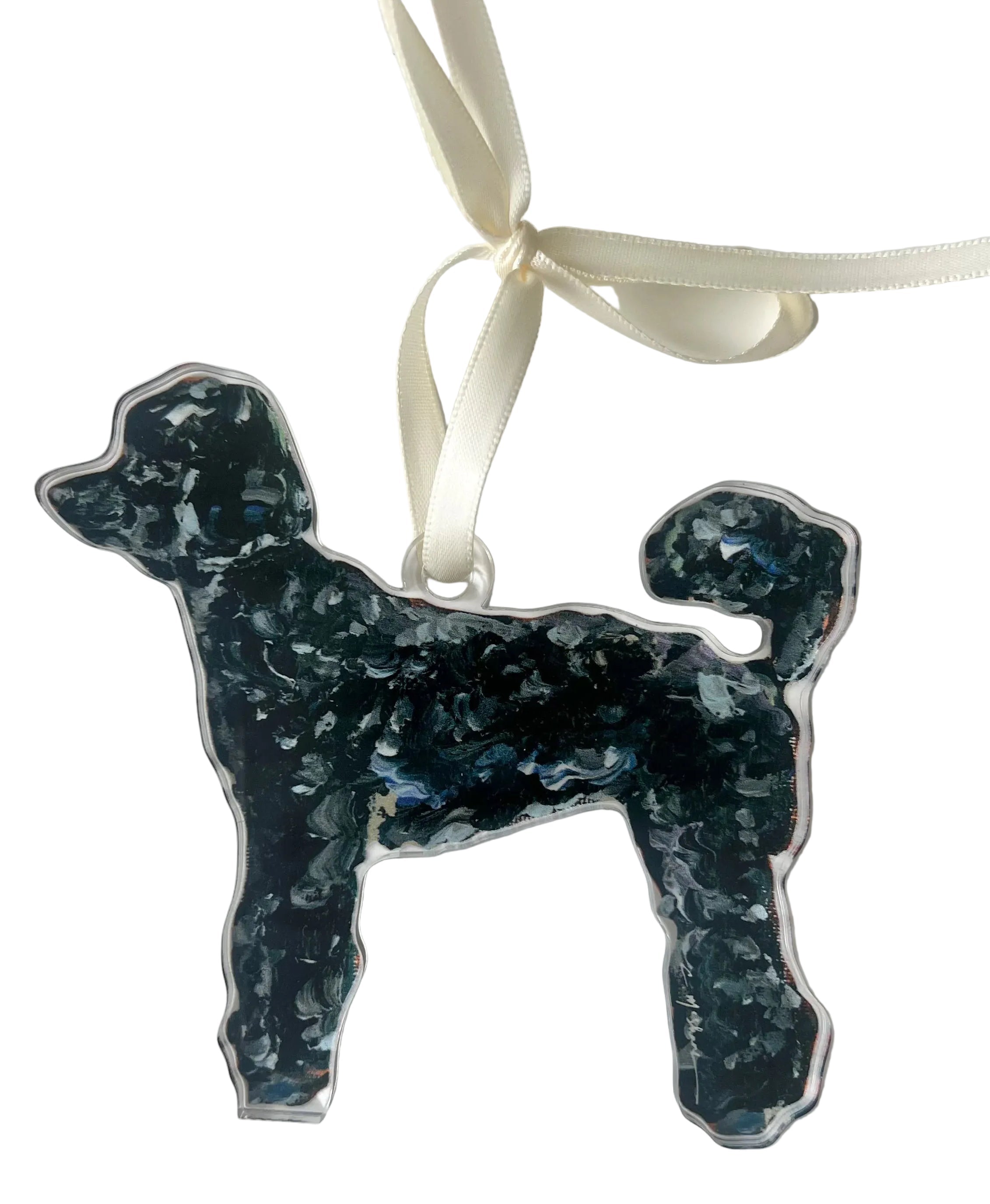 Dog-shaped ornament with blue speckled pattern on a white background
