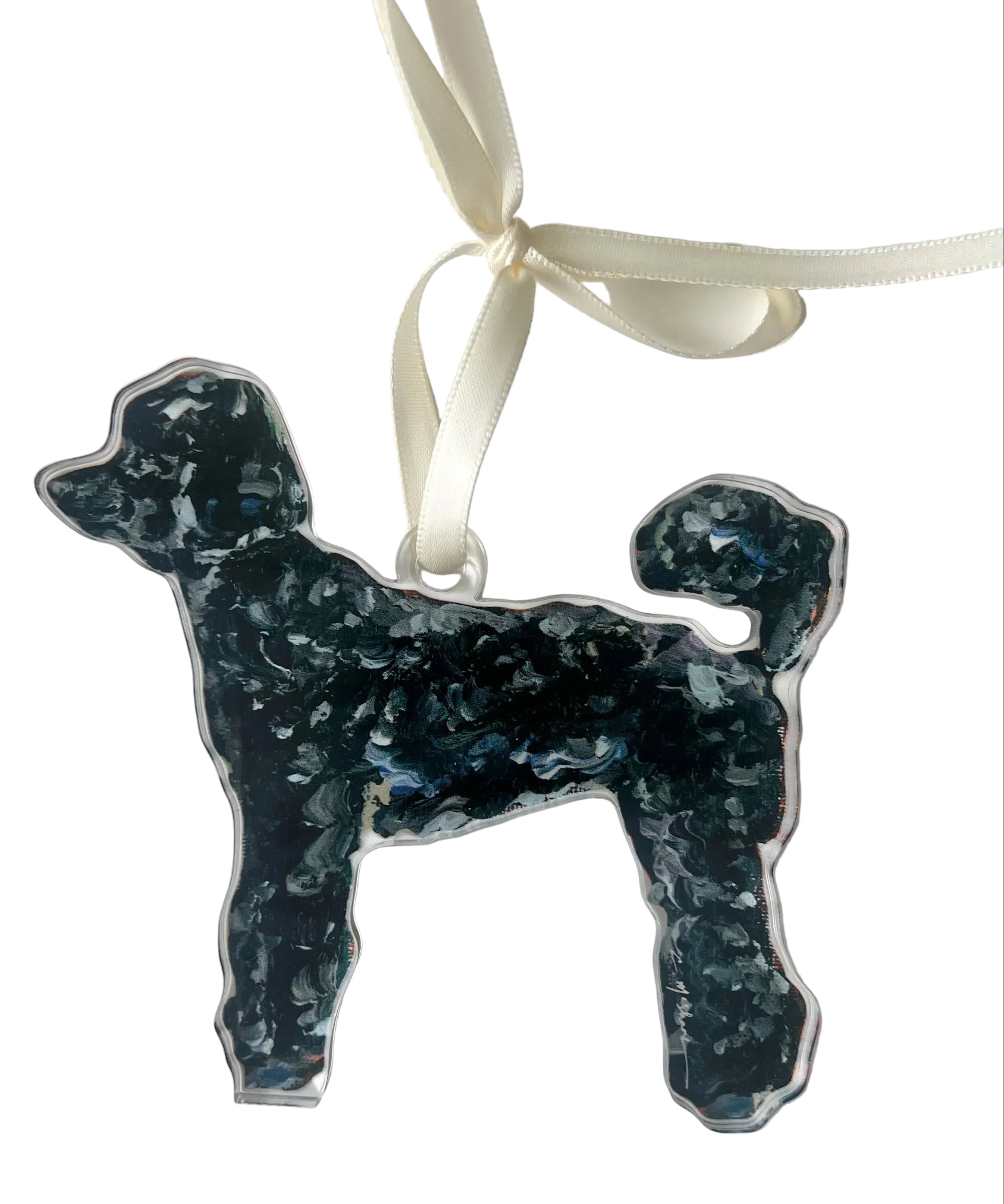 Dog-shaped ornament with blue speckled pattern on a white background