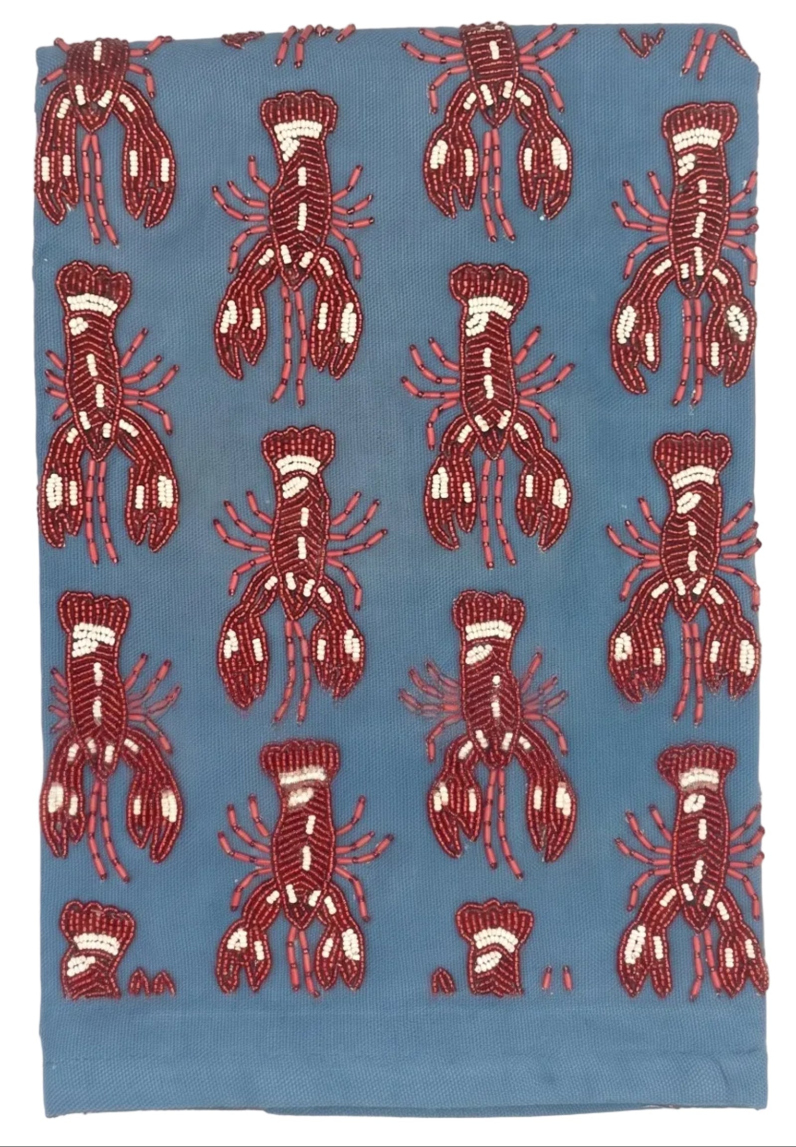 A square piece of blue fabric featuring a repeating pattern of red and white lobster motifs, laid flat against a white background.