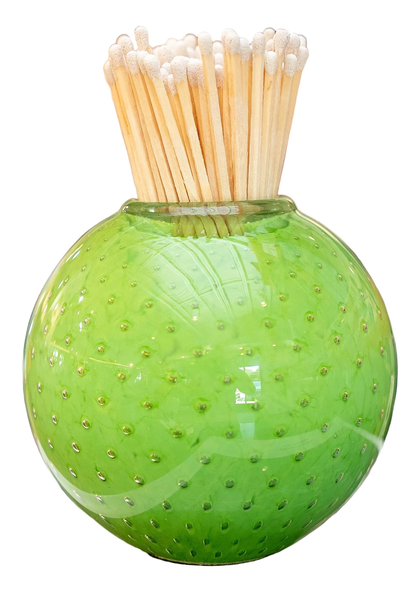 A round, textured green glass vase filled with wooden matchsticks, isolated on a white background.