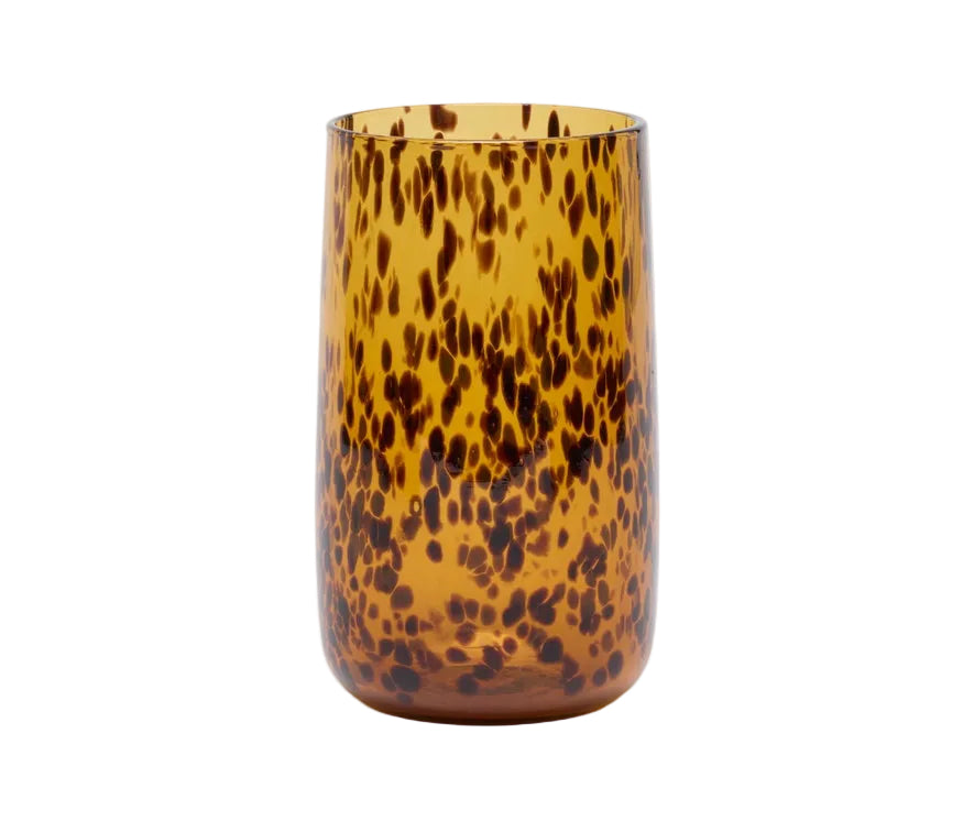 Tortoiseshell-patterned glass on a white background
