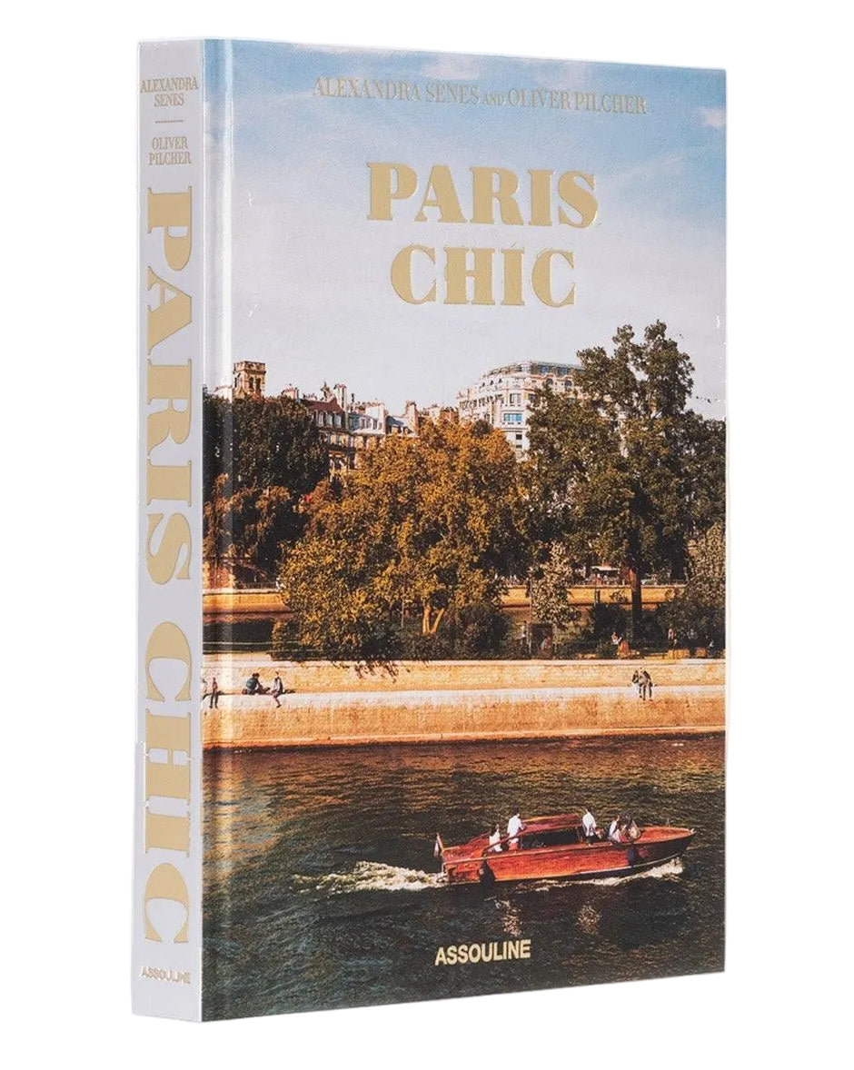 Book titled 'Paris Chic' with a scenic cover featuring a boat on a river.