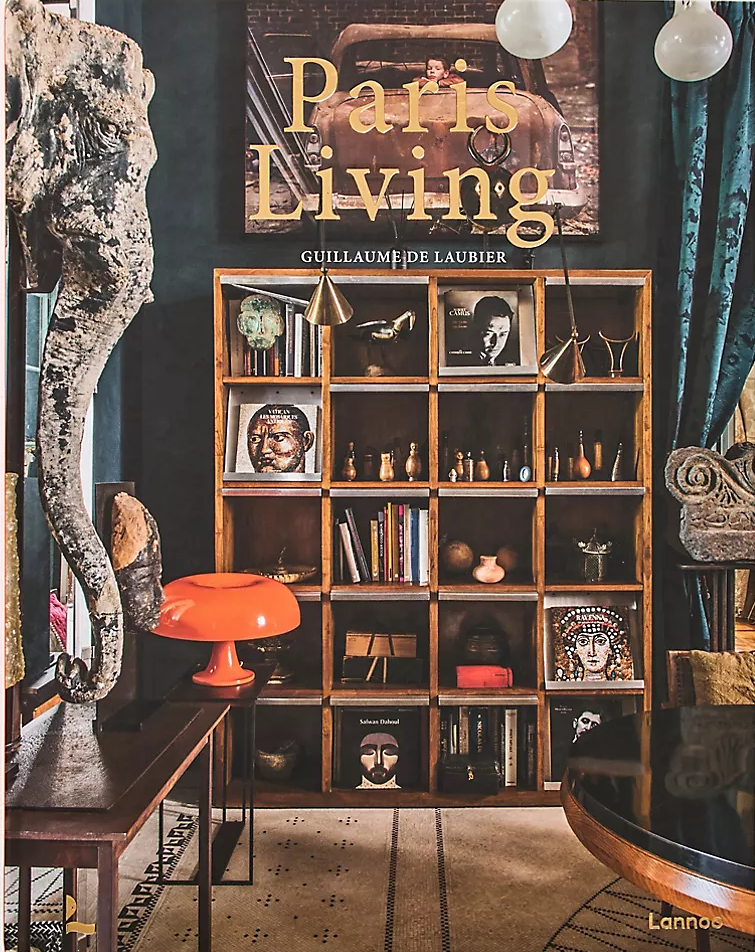 Book titled 'Paris Living' with a decorative cover featuring a shelf and various objects.