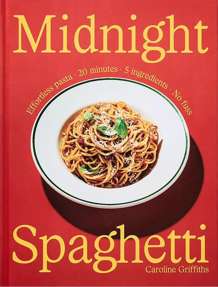 The front cover of the book 'Midnight Spaghetti' by Caroline Griffiths, featuring a bright red background with bold yellow title text and a photo of spaghetti in a white bowl near the center.