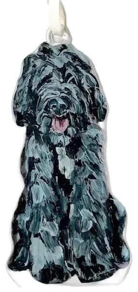 Dog-shaped ornament with a black and gray pattern on a white background