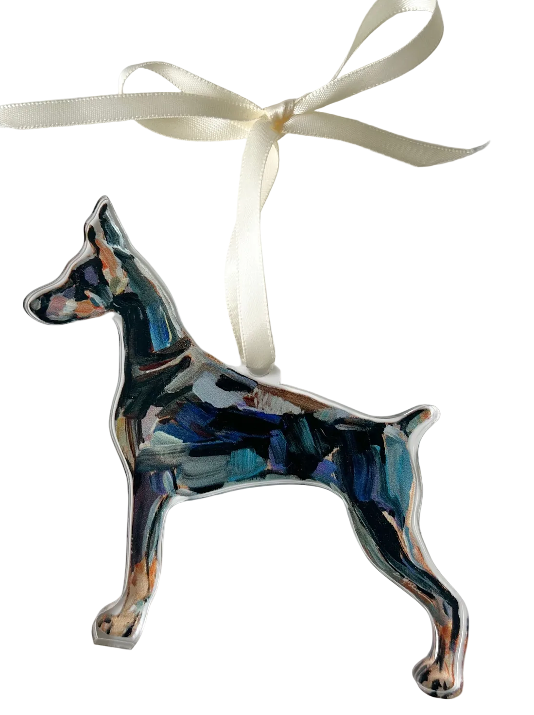 Decorative dog ornament with a ribbon on a white background