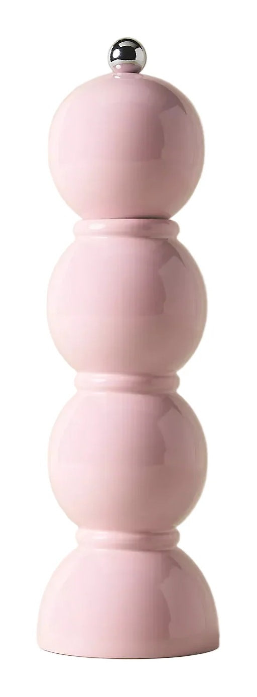 A pastel pink pepper mill with a stacked, rounded design and a small metallic silver knob on top, set against a solid light beige background.