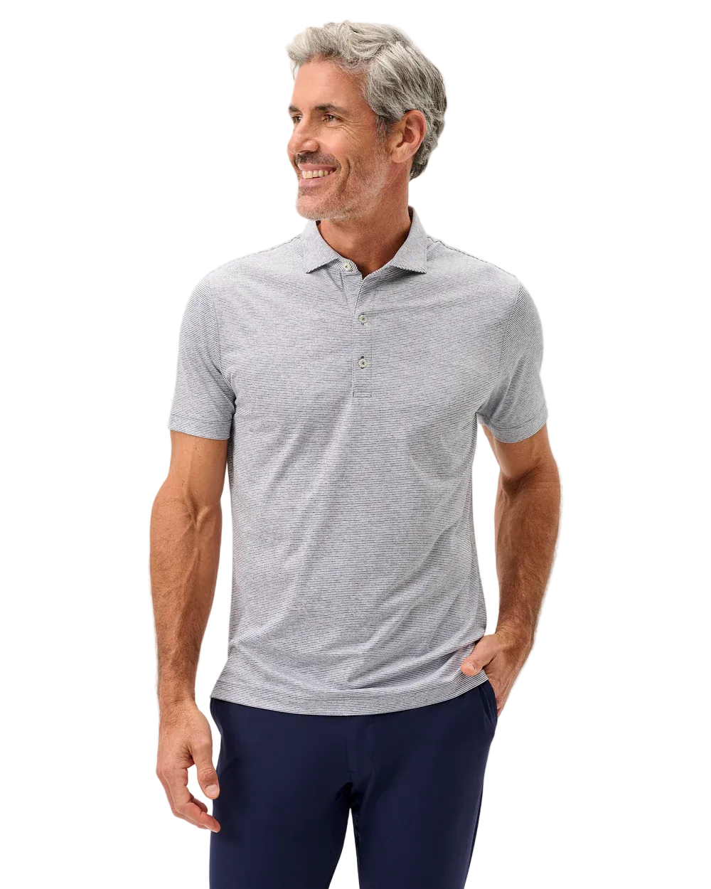 Man wearing a gray polo shirt and navy pants on a light gray background