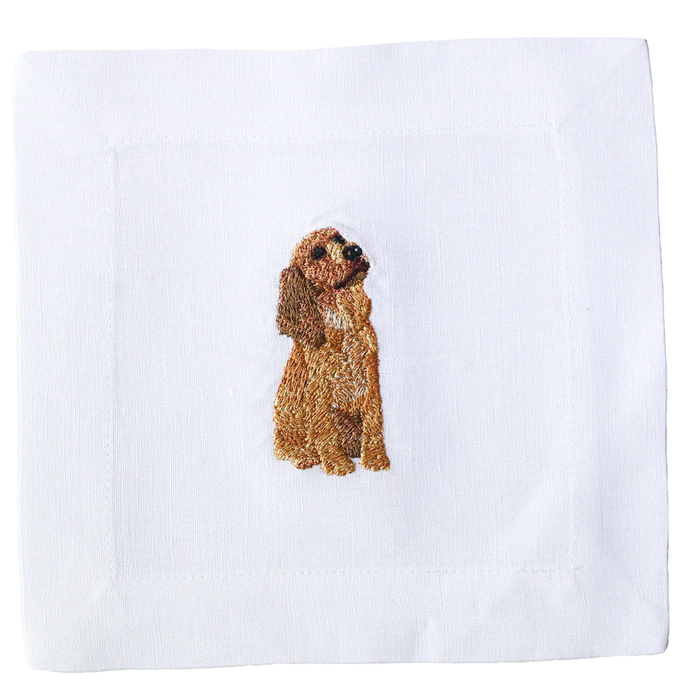 Embroidered dog design on a white fabric