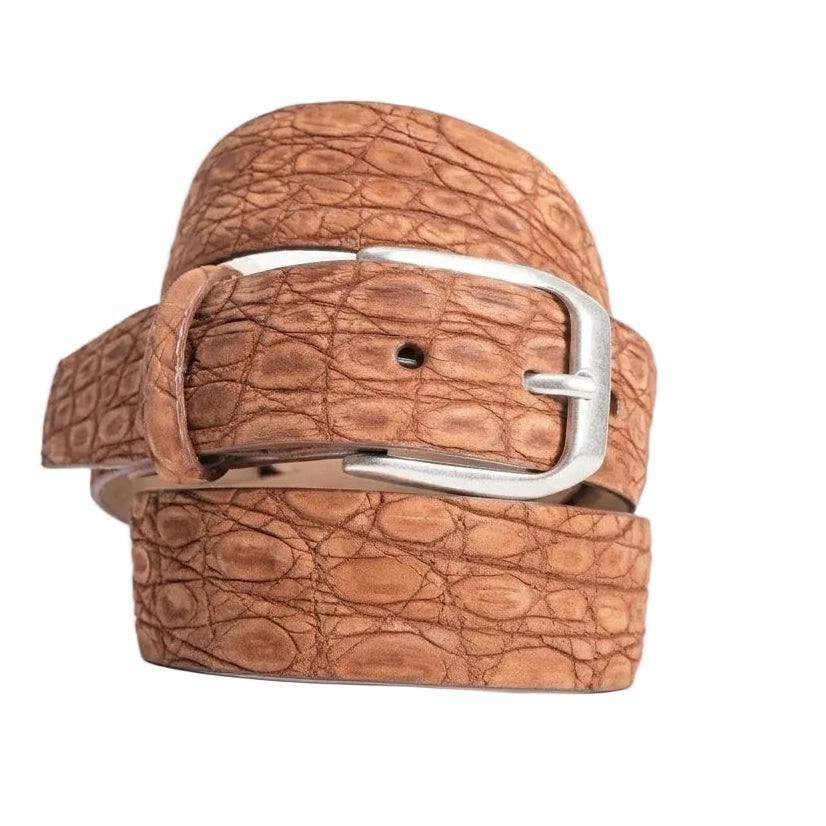 Brown crocodile-patterned belt with a silver buckle on a white background