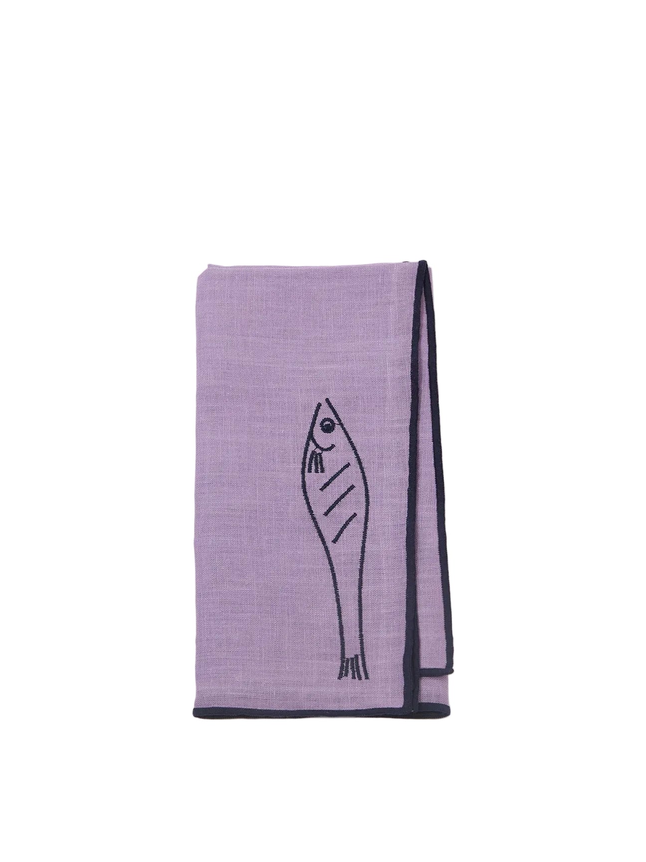 Purple towel with fish design on a white background