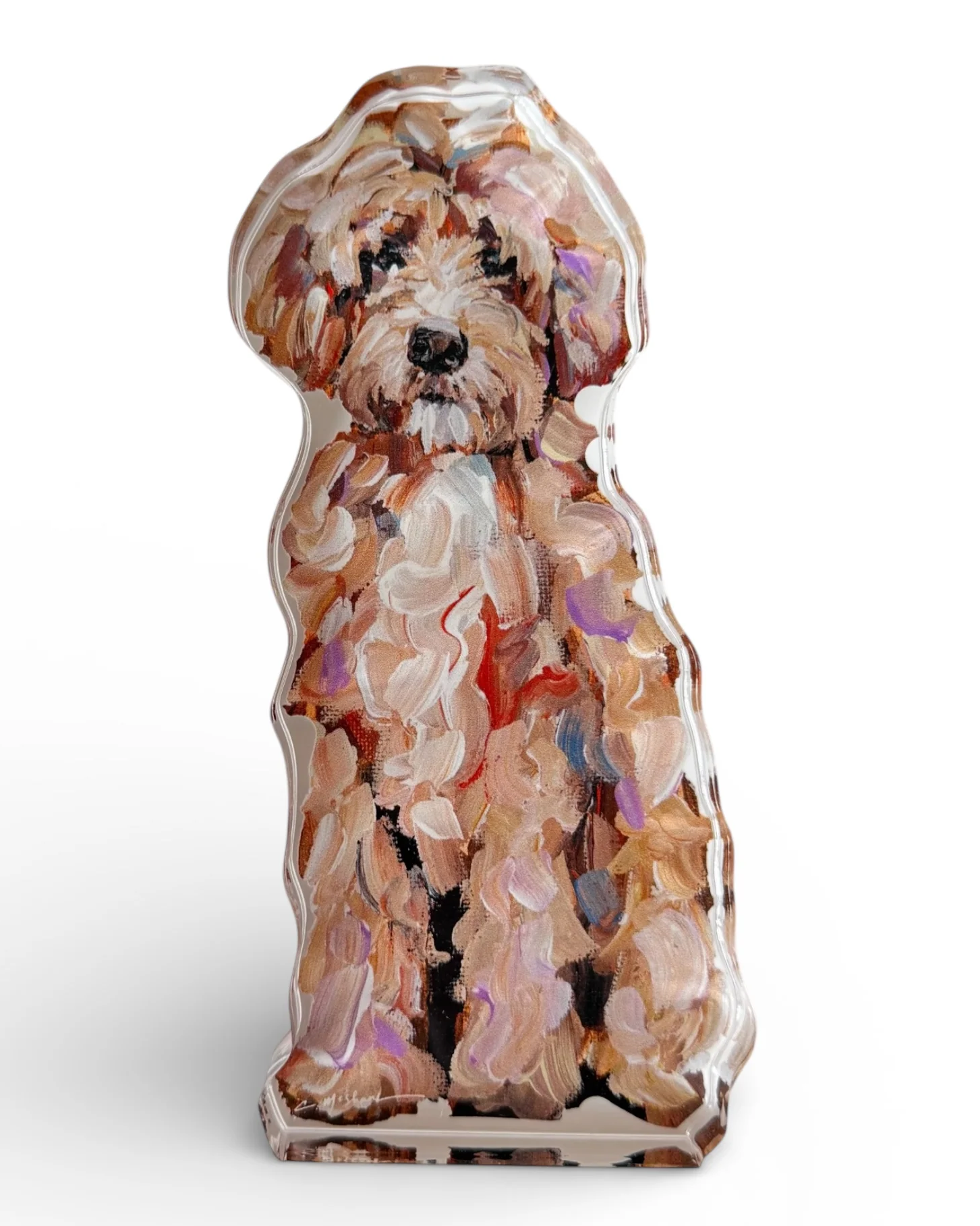 Dog-shaped decorative item with a colorful design on a white background