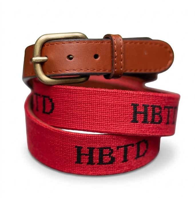 Red belt with black text and a brown leather buckle on a white background
