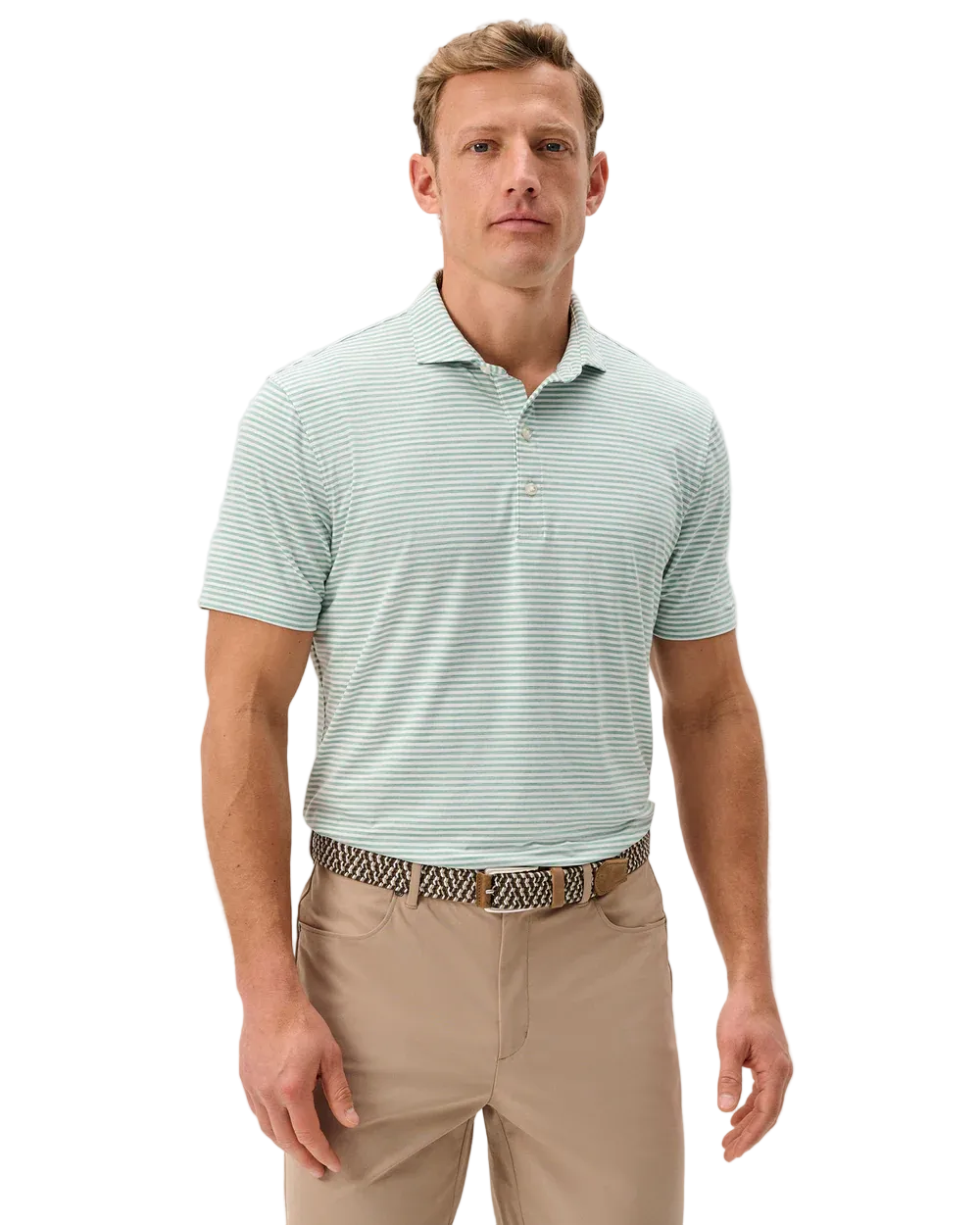 Man wearing a light green striped polo shirt and beige pants on a plain background