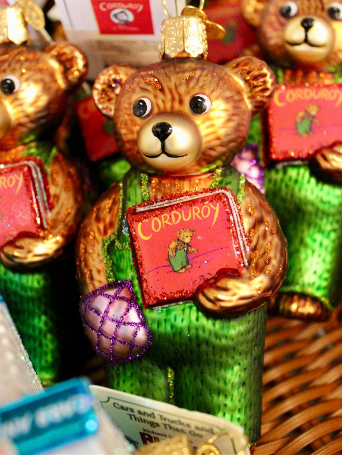 Decorative teddy bears with 'Corduroy' books in a basket