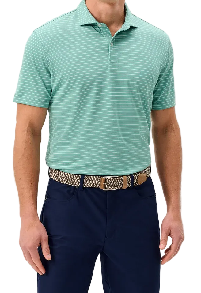 Man wearing a green striped polo shirt and navy pants on a light gray background