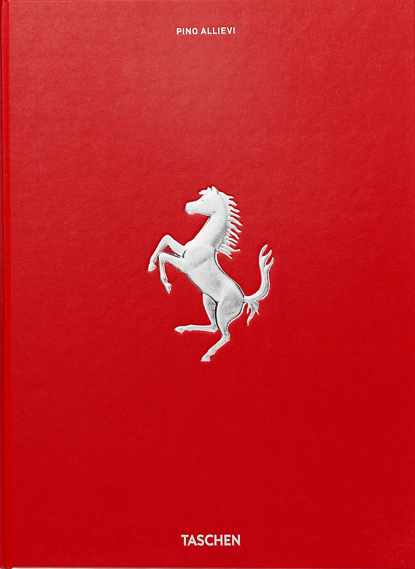 A red hardcover book featuring a large silver embossed Ferrari prancing horse logo in the center, with the text 'PINO ALLIEVI' at the top and 'TASCHEN' at the bottom, photographed against a light off-white background.