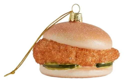 Glass ornament shaped like a burger with a white background