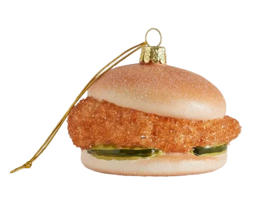 Glass ornament shaped like a burger with a white background