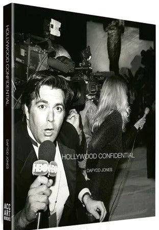 Book cover of 'Hollywood Confidential' with a black and white photo of a person holding a microphone.