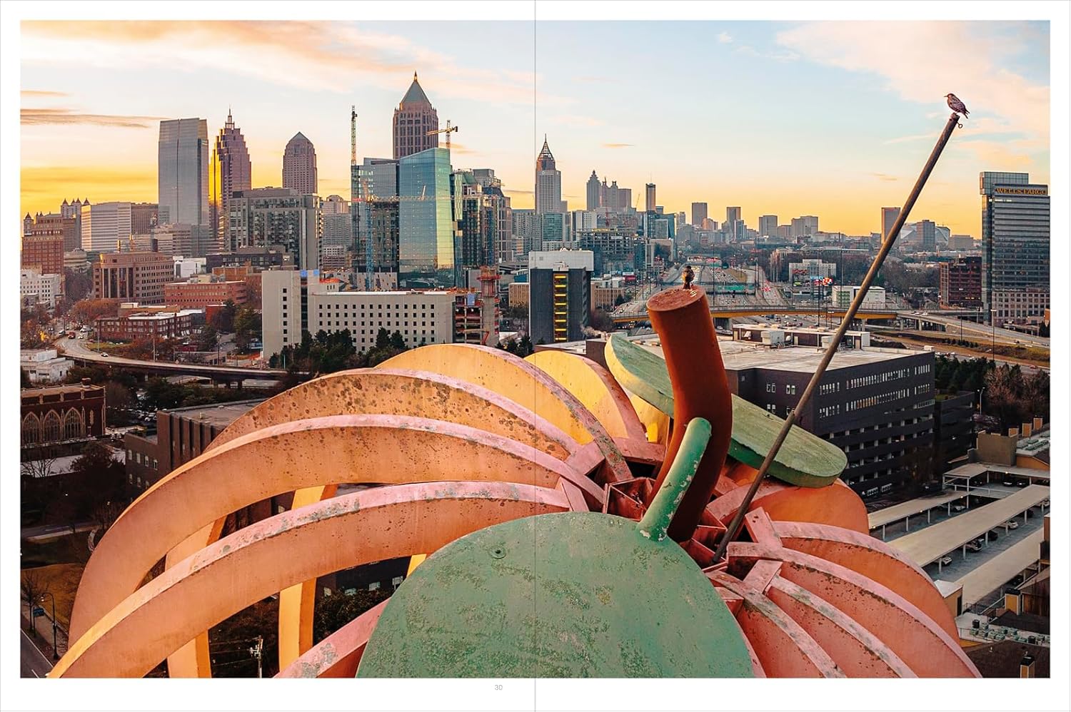 Atlanta city skyline with a focus on architectural details of a building's roof.