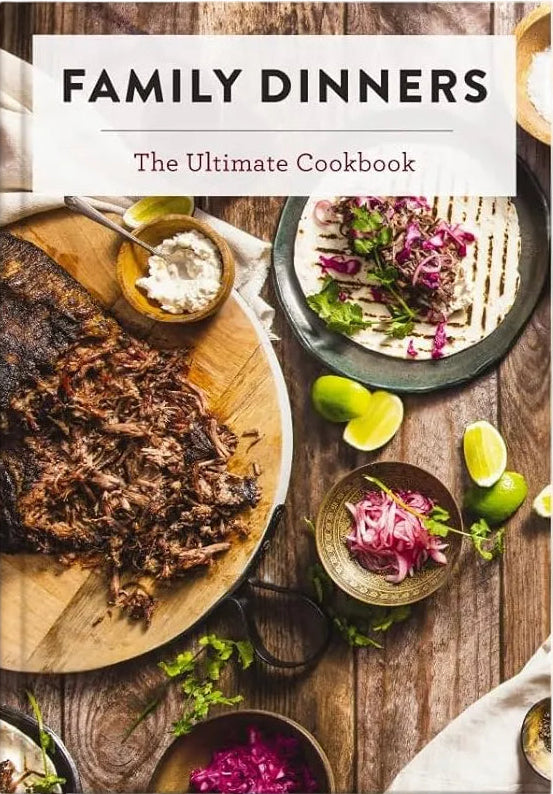 Cookbook titled 'Family Dinners: The Ultimate Cookbook' with images of food on a wooden table.