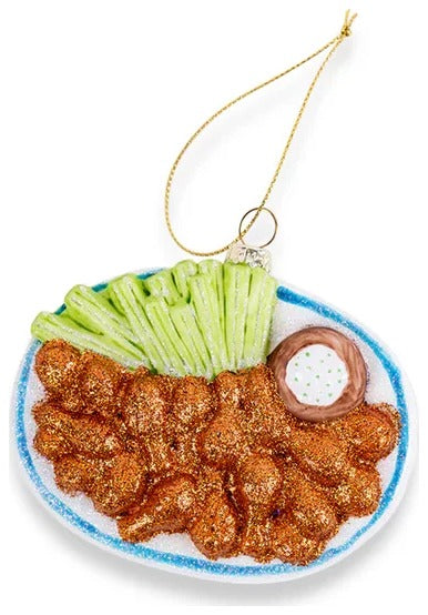 Fried chicken with pickles and sauce on a white background