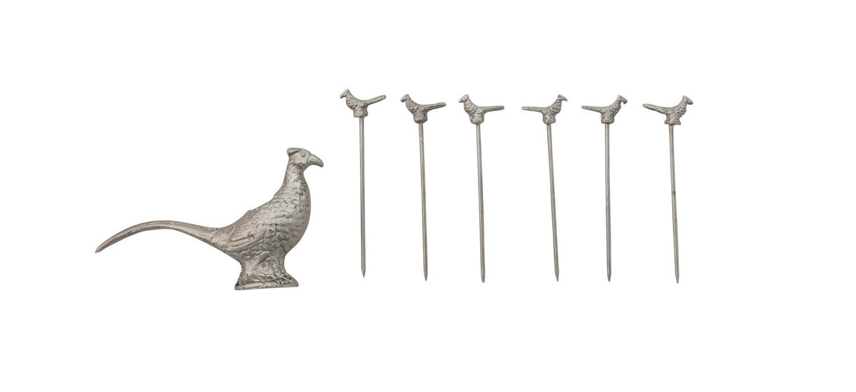 Set of silver pheasant-shaped cocktail picks with packaging on a white background