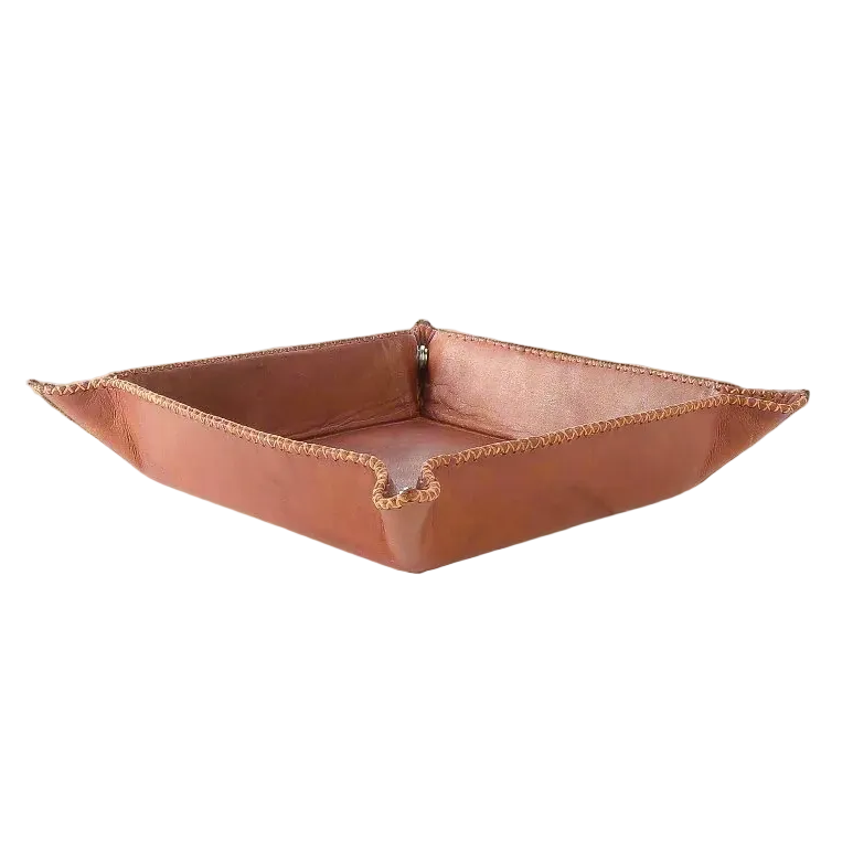 Rectangular leather tray on a light surface with a neutral background