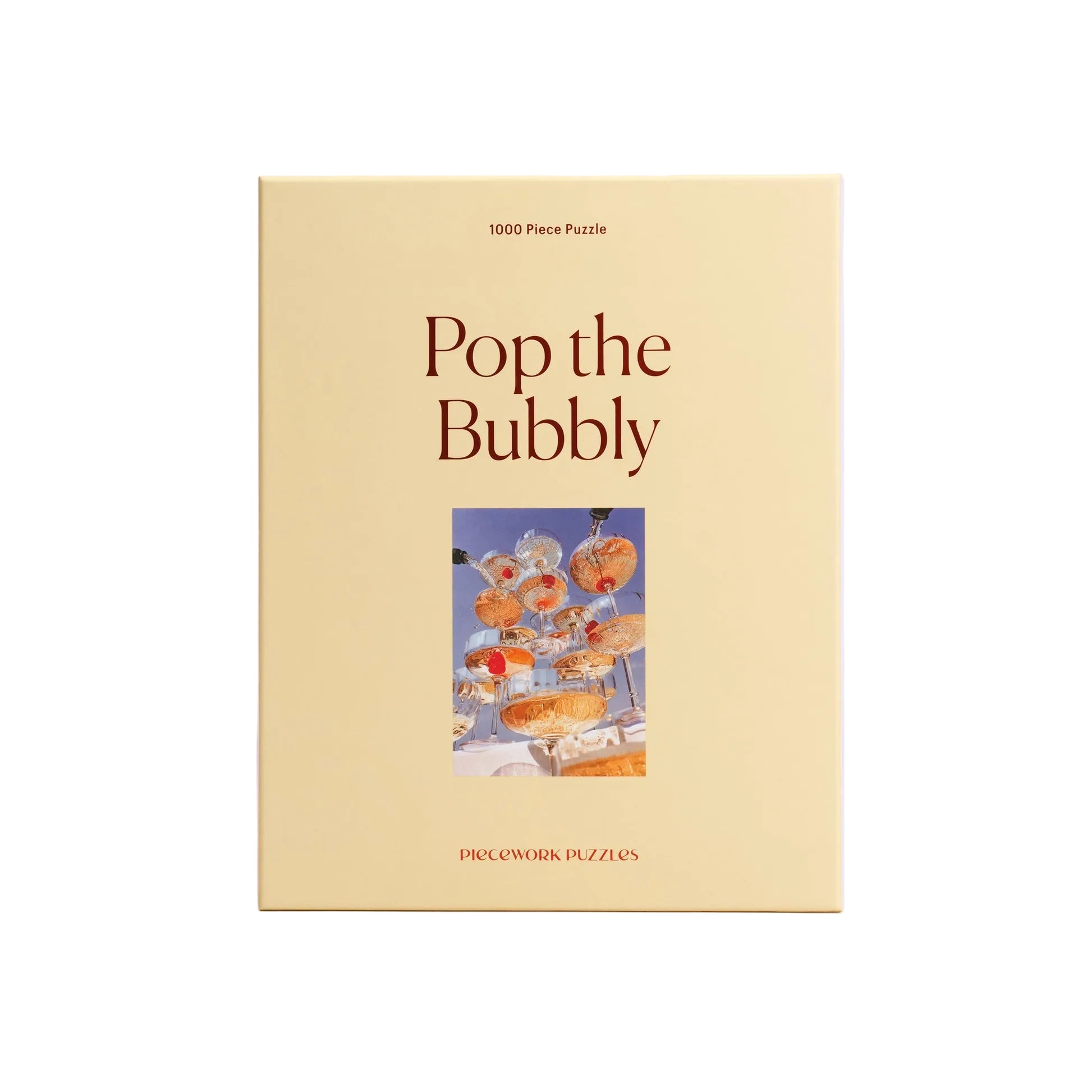 Puzzle box titled 'Pop the Bubbly' with a champagne-themed illustration on a light purple background.