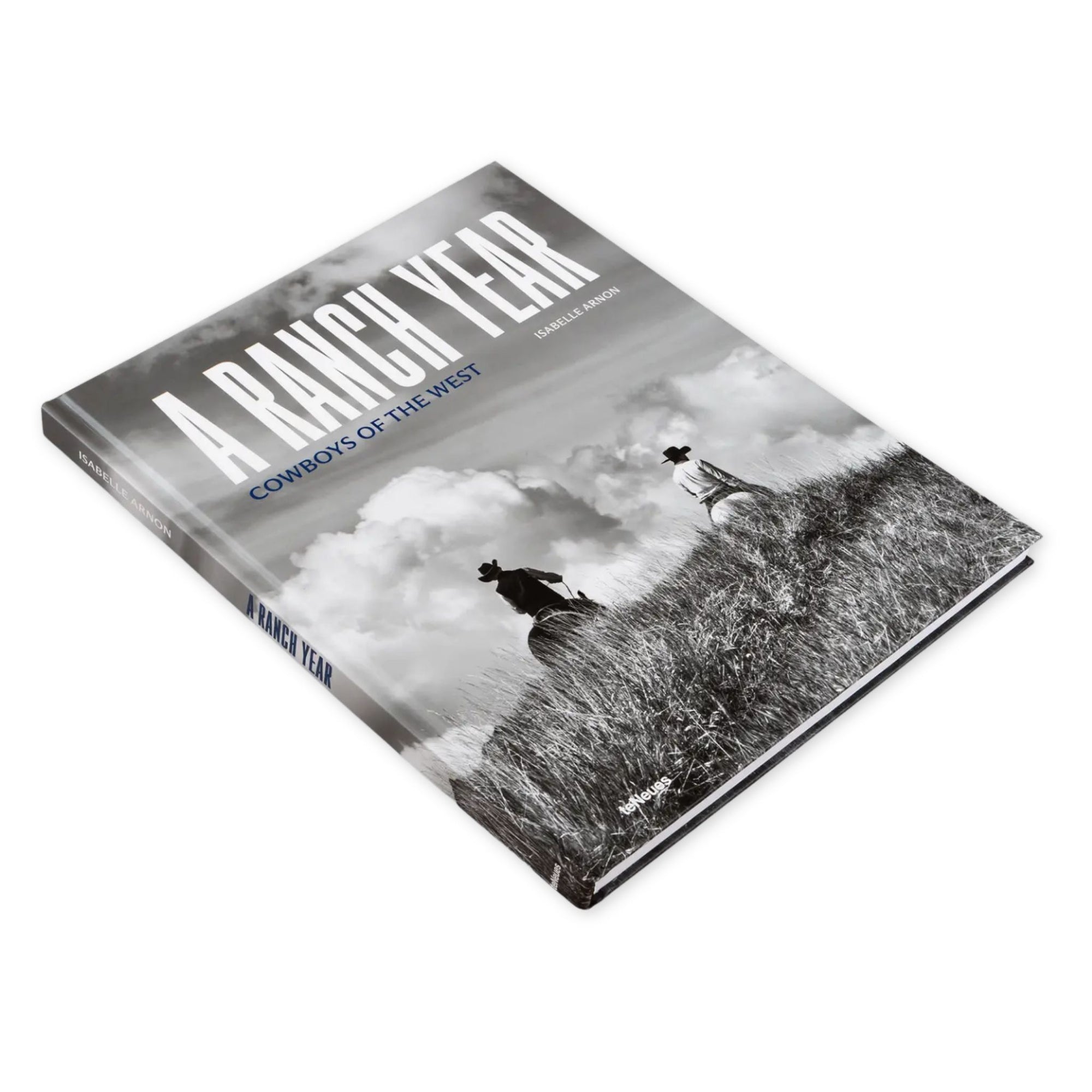 Book titled 'A Ranch Year: Cowboys of the West' on a white background