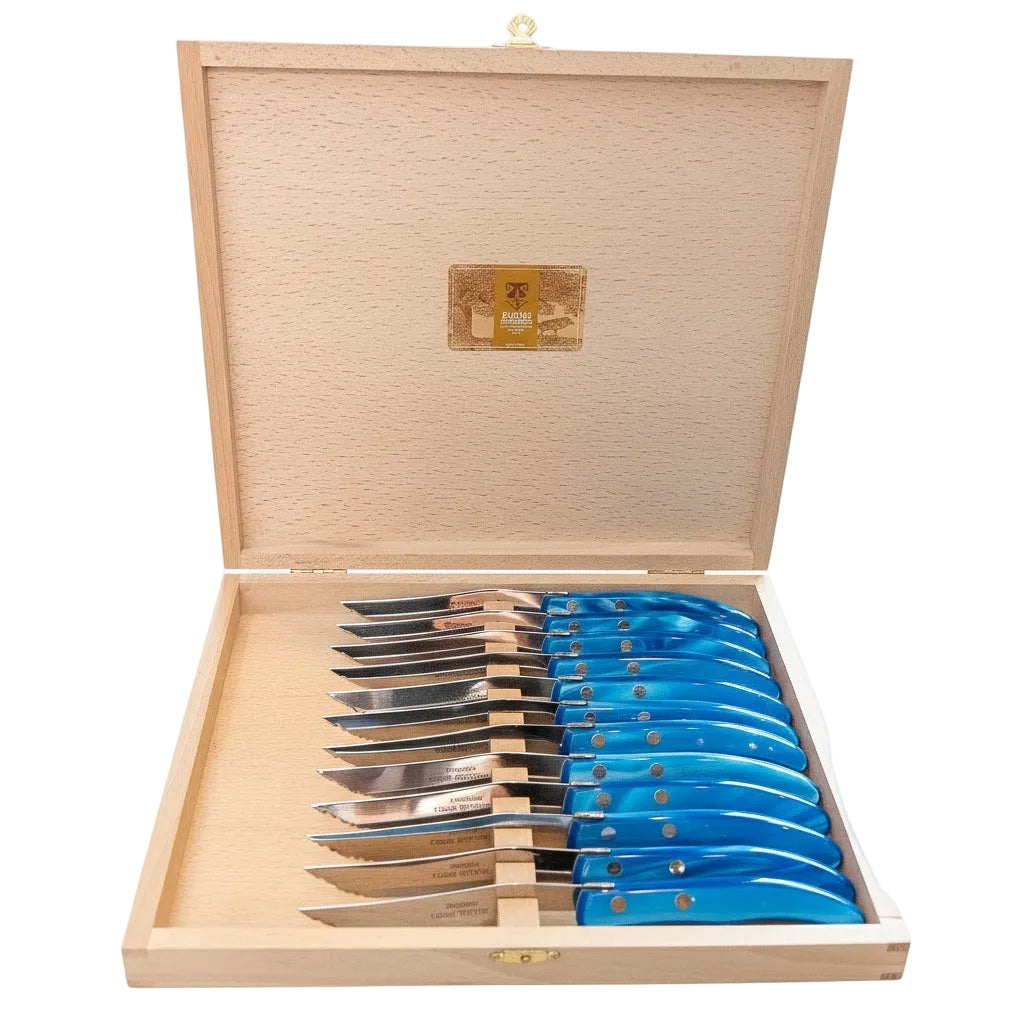Set of steak knives with blue handles in a wooden box