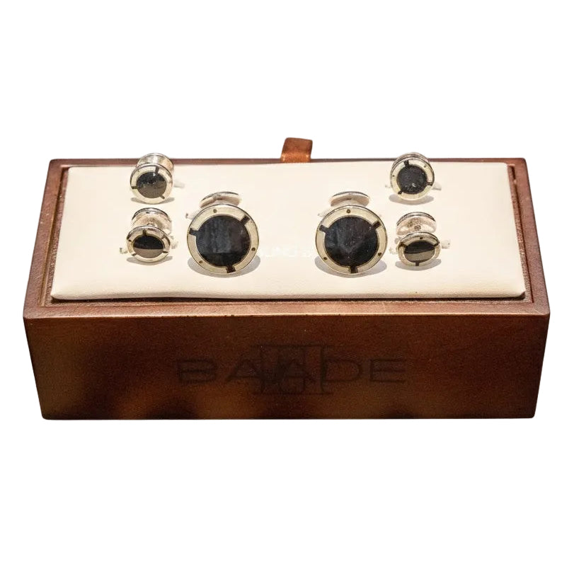 Wooden box with black and gold components on a white background