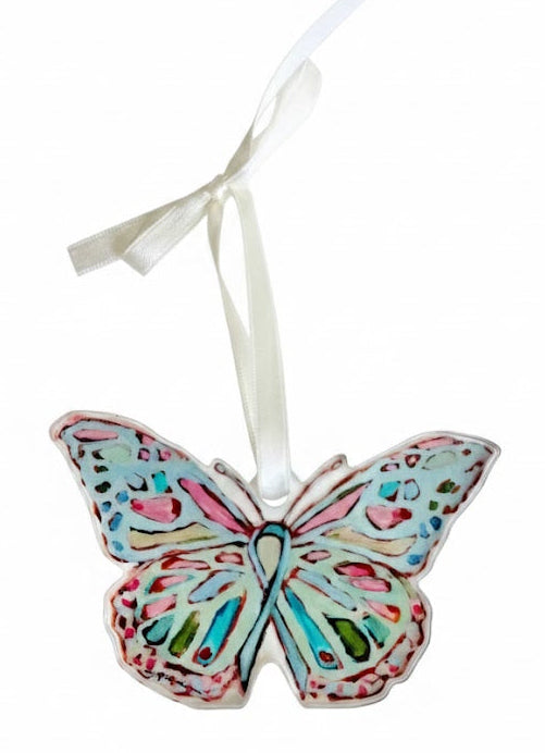 Decorative butterfly ornament with a ribbon on a white background
